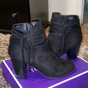 Black booties with tassel detail